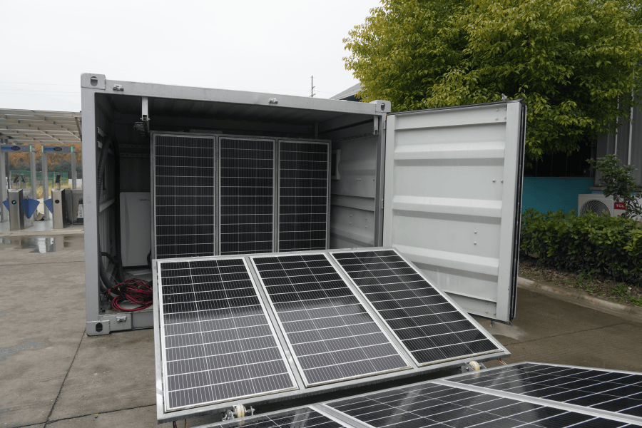 Interior view of a liquid-cooled battery rack showing coolant plates and piping in an industrial BESS container